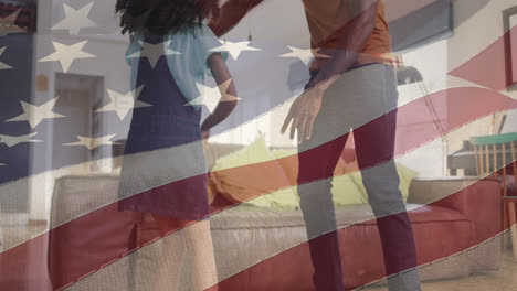 Animación-De-La-Bandera-De-Los-Estados-Unidos-De-América-Sobre-Un-Padre-Y-Una-Hija-Afroamericanos-Bailando.