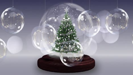 Animation-of-snow-globe-with-christmas-tree-over-christmas-baubles-decoration