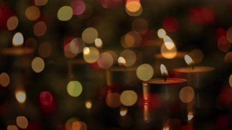 Animation-of-candles-over-christmas-tree-and-presents