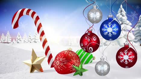 Animation-of-christmas-baubles-decoration-with-candy-cane-over-winter-landscape
