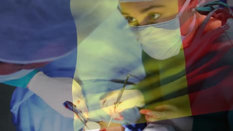 Animation-of-flag-of-france-waving-over-surgeons-in-operating-theatre