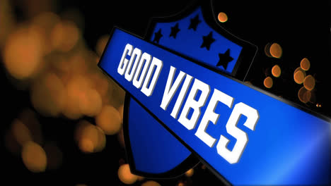 Animation-of-good-vibes-text-on-shield-over-gold-lights-on-dark-background