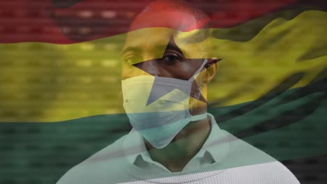Animation-Der-Flagge-Ghanas,-Die-Während-Der-Covid-19-Pandemie-über-Einem-Mann-Mit-Gesichtsmaske-Weht