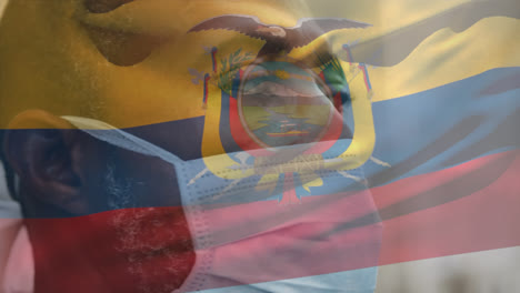 Animation-of-flag-of-equador-waving-over-african-american-man-wearing-face-mask-in-city-street