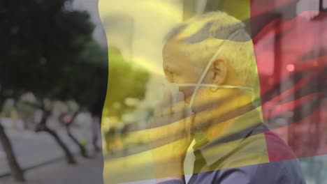 Animation-Der-Belgischen-Flagge,-Die-über-Einem-Kaukasischen-Mann-Mit-Gesichtsmaske-In-Der-Stadtstraße-Weht
