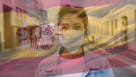 Animation-of-flag-of-spain-waving-over-woman-wearing-face-mask-during-covid-19-pandemic