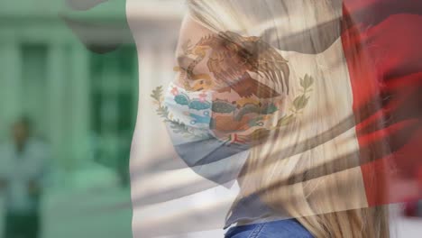 Animation-of-flag-of-mexico-waving-over-woman-wearing-face-mask-during-covid-19-pandemic