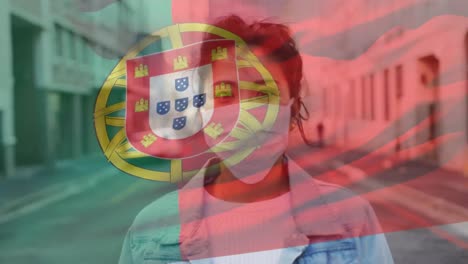 Animation-of-flag-of-portugal-waving-over-woman-wearing-face-mask-during-covid-19-pandemic