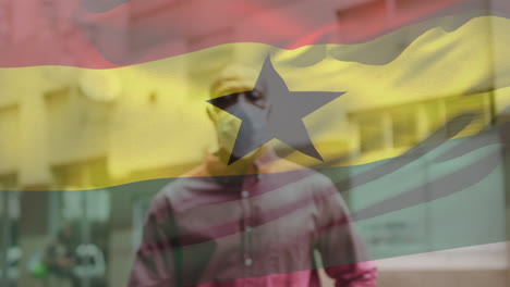 Animation-Der-Flagge-Ghanas,-Die-Während-Der-Covid-19-Pandemie-über-Einem-Mann-Mit-Gesichtsmaske-Weht