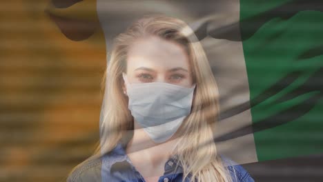 Animation-Der-Flagge-Der-Elfenbeinküste,-Die-Während-Der-Covid-19-Pandemie-über-Einer-Frau-Mit-Gesichtsmaske-Weht