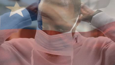 Animation-of-flag-of-chile-waving-over-man-wearing-face-mask-during-covid-19-pandemic