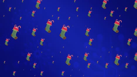 Animation-of-christmas-socks-falling-on-blue-background