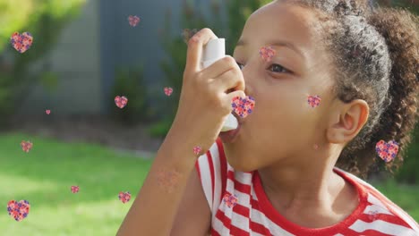 Animation-of-flower-hearts-over-african-american-girl-using-inhaler-in-garden