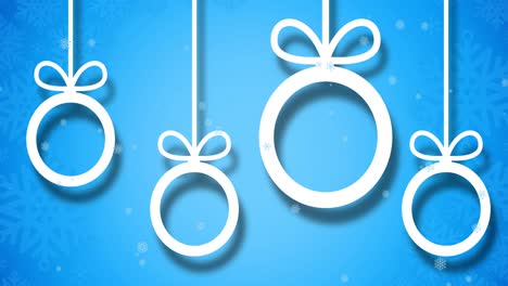Animation-of-snow-falling-over-baubles-on-blue-background