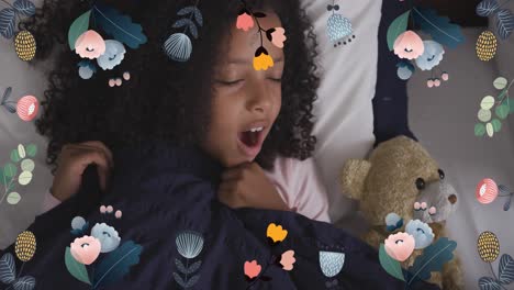 Animation-of-flowers-over-african-american-girl-yawning-in-bed