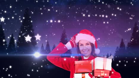 Animation-of-happy-caucasian-woman-wearing-santa-hat-keeping-present-over-winter-scenery