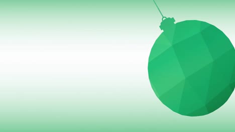 Animation-of-green-christmas-bauble-over-green-background