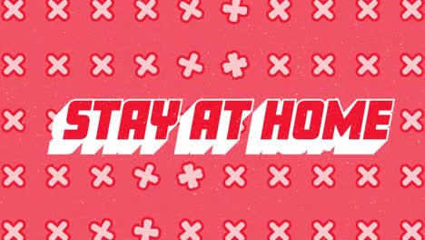 Animation-of-snow-falling-over-stay-at-home-text-with-cross-pattern-on-red-background