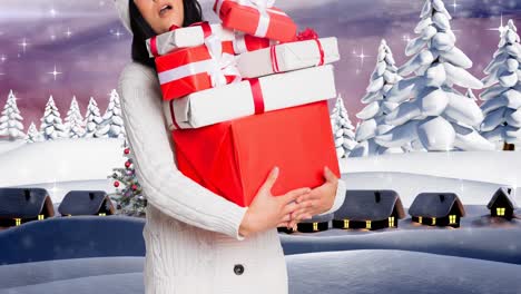 Animation-of-happy-caucasian-woman-wearing-santa-hat-keeping-presents-over-winter-scenery