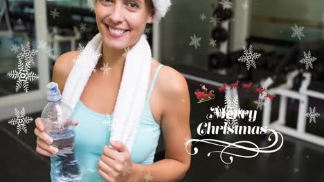 Animation-of-snow-falling-and-merry-christmas-text-over-happy-caucasian-sportswoman
