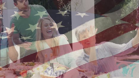 Animation-of-american-flag-over-family-during-dinner-taking-selfie