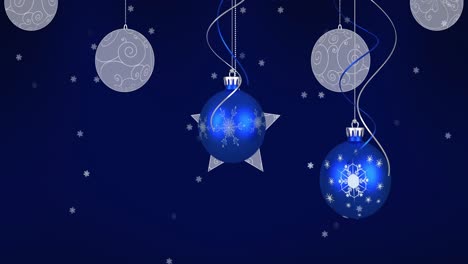 Animation-of-baubles,-stars-and-snow-falling-on-dark-blue-background