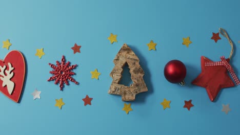 Video-of-homemade-christmas-decorations-with-stars-on-blue-background