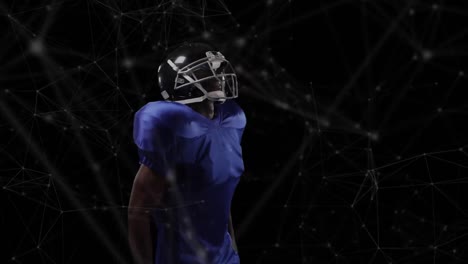 Animation-of-network-of-connections-over-african-american-american-football-player
