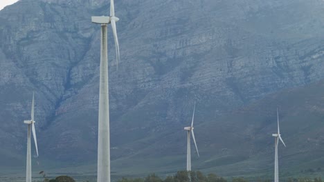 General-view-of-wind-turbines-in-countryside-landscape-with-mountains