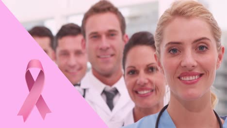 Animation-of-pink-breast-cancer-ribbon-over-group-of-smiling-doctors