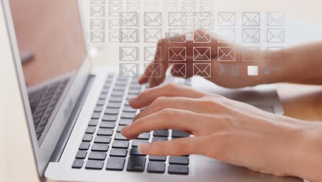 Animation-of-envelope-icons-over-woman-using-laptop