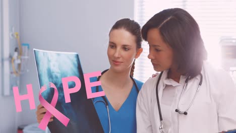 Animation-of-pink-breast-cancer-ribbon-over-two-female-smiling-doctors