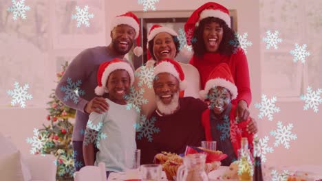 Animation-of-snow-falling-over-smiling-family-with-santa-hats-embracing
