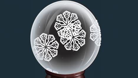 Animation-of-snow-globe-with-snowflakes-falling-on-blue-background
