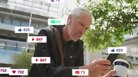 Animation-of-social-media-icons-over-senior-man-using-smartphone