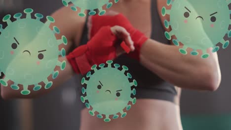 Animation-of-virus-cells-over-midsection-of-caucasian-woman-preparing-for-boxing