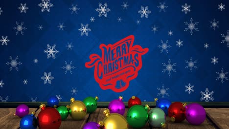 Animation-Von-Kugeln-Und-Schneeflocken-über-„Frohe-Weihnachten“-Text-Auf-Blauem-Hintergrund