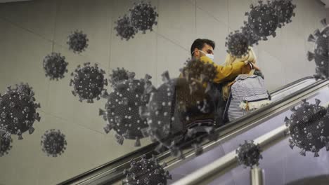 Animation-of-virus-cells-over-back-view-of-caucasian-couple-on-escalators