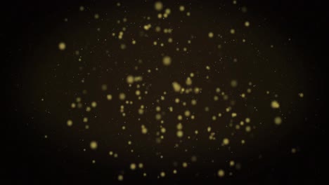 Animation-of-warm-glowing-yellow-spots-floating-on-black-background