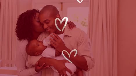 Animation-of-white-hearts-over-happy-african-american-parents-with-child-at-home
