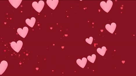 Animation-of-pink-hearts-icons-floating-on-red-background