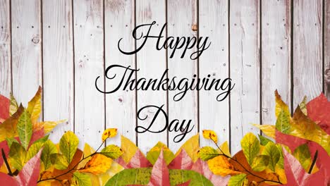 Happy-thanksgiving-day-text-banner-and-autumn-leaves-against-wooden-background