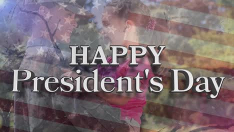 Happy-presidents-day-text-over-american-flag-against-female-caucasian-soldier-carrying-her-daughter