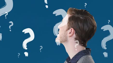 Animation-of-question-marks-over-caucasian-man-on-blue-background