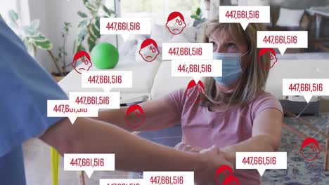Animation-of-numbers-and-icons-over-caucasian-senior-woman-and-nurse-wearing-face-masks-exercising