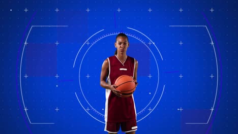 Animation-of-scope-scanning-over-female-basketball-player-holding-ball-on-blue-background