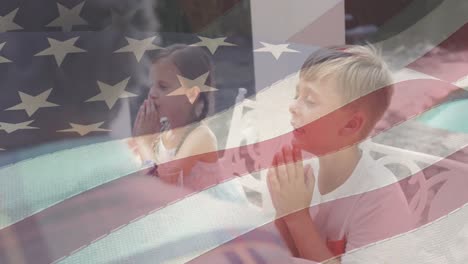 Animation-of-american-flag-over-caucasian-family-having-dinner-and-praying