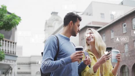Animation-of-social-media-icons-floating-over-happy-caucasian-couple-drinking-takeaway-coffee