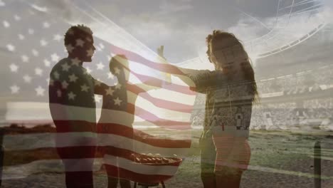 Animation-of-waving-flag-of-usa-over-group-of-friends-having-fun-on-the-beach-and-stadium