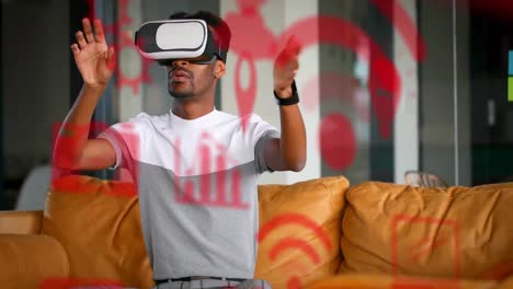 Animation-of-social-media-icons-over-african-american-man-wearing-vr-headset
